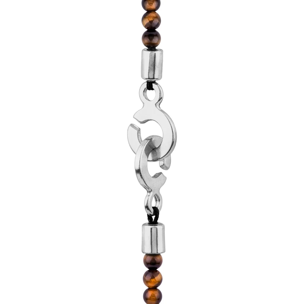 Collar de 39cm con piedras de 4mm, mini donas en acero, dije de ojo terminado en acero anticado - Joyería y bisutería fina